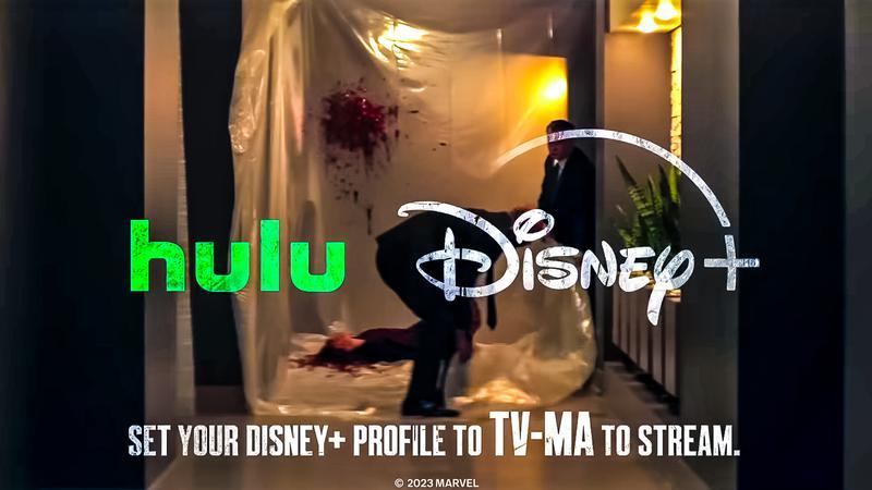 Two people are wrapping a body, surrounded by blood, with the Hulu and Disney Plus logos on top. There is a message to set your Disney Plus profile to T.V.-M.A. to stream the show.