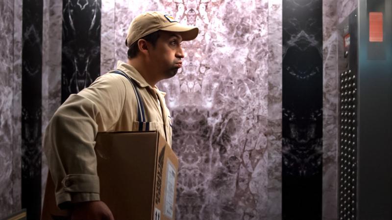 Lin-Manuel Miranda as Hermes in elevator in Percy Jackson Episode 3